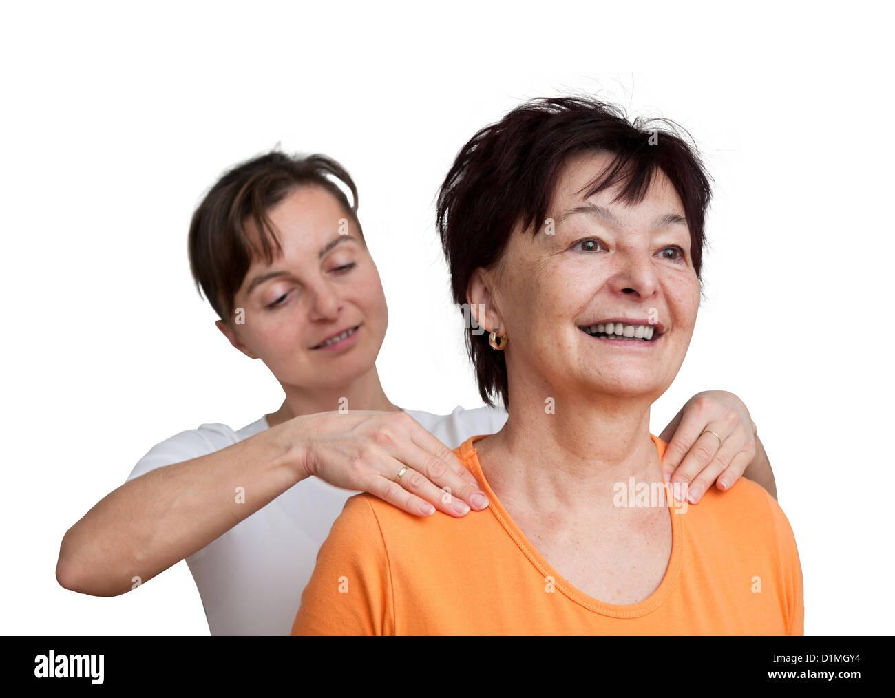 Young woman giving massage to senior - isolated on white Stock Photo