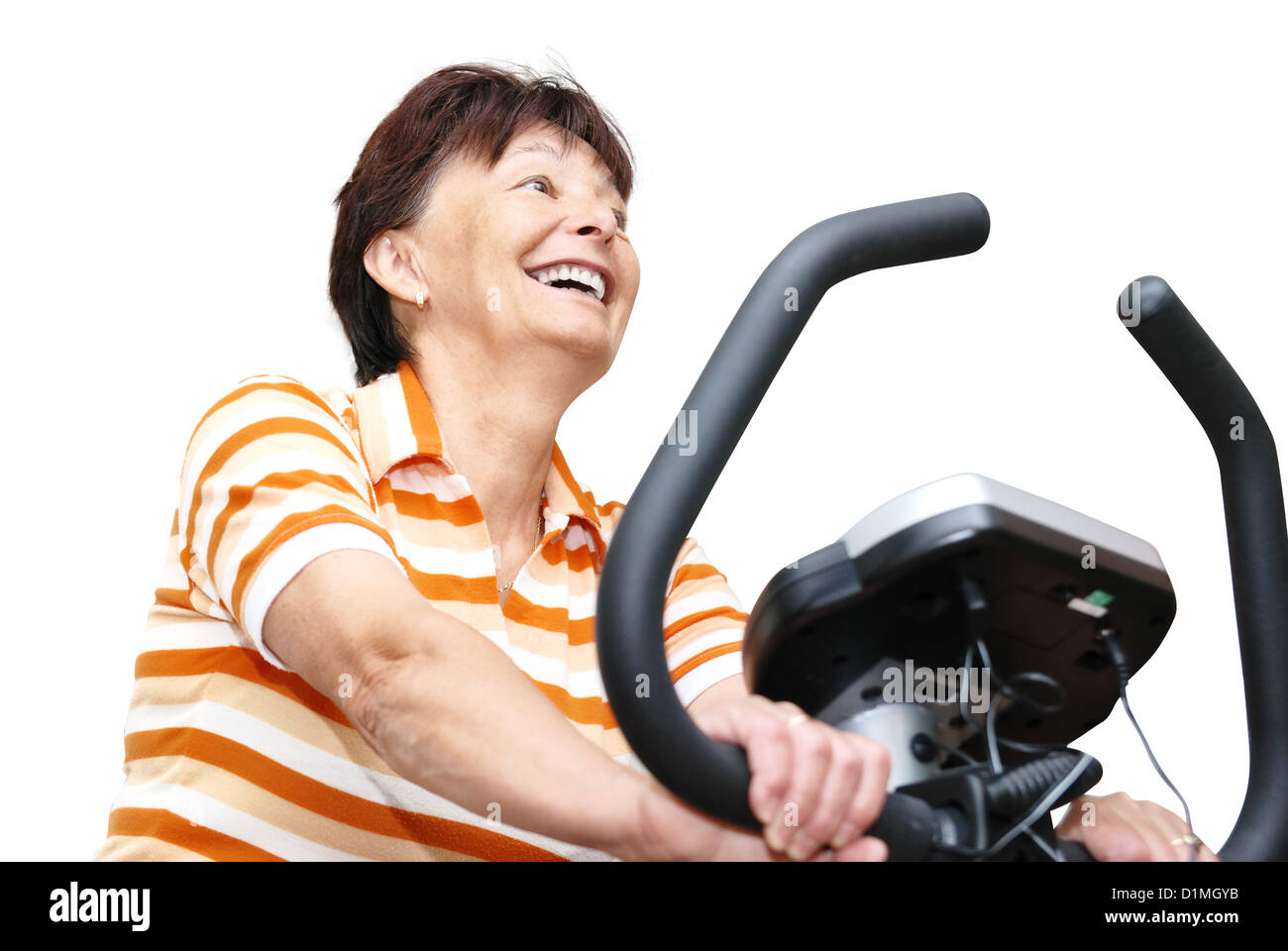 Senior woman exercise on spinning bicycle at home Stock Photo