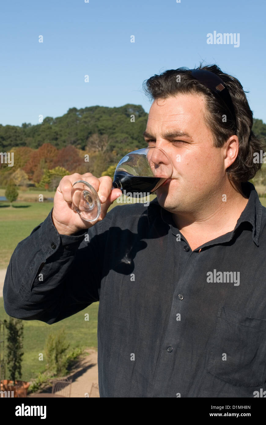A winemaker sampling the finished product Stock Photo