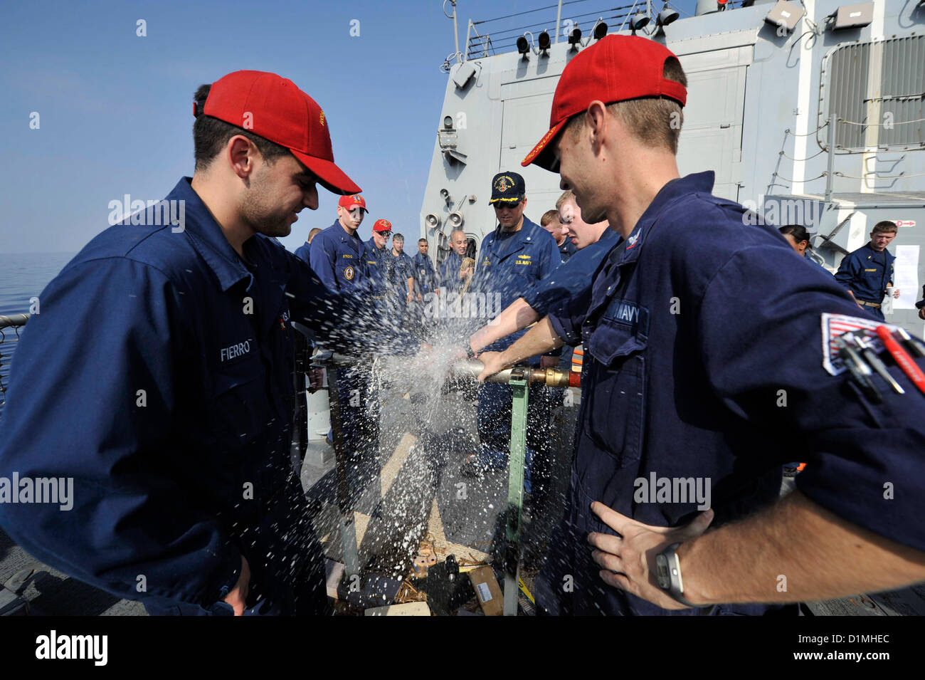 Sailors test a pipe patch during damage control Olympics aboard the guided-missile destroyer USS Jason Dunham (DDG 109). Jason Dunham is deployed to the U.S. 5th Fleet area of responsibility conducting maritime security operations, theater security cooperation efforts and support missions for Operation Enduring Freedom..ARABIAN SEA (Dec.29, 2012) US Navy Photo Stock Photo