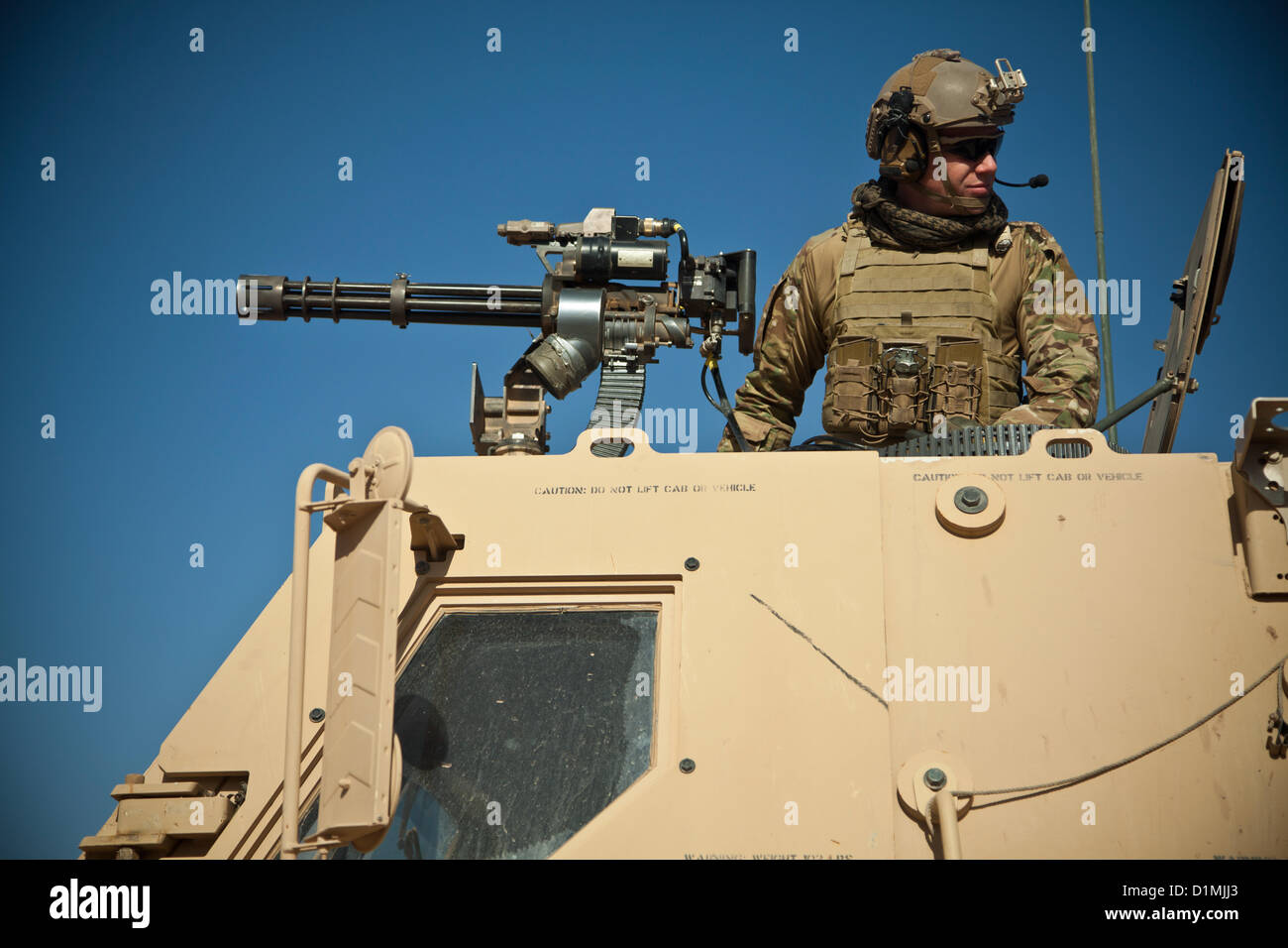 A coalition force member fires the Mark 44 minigun during live fire ...