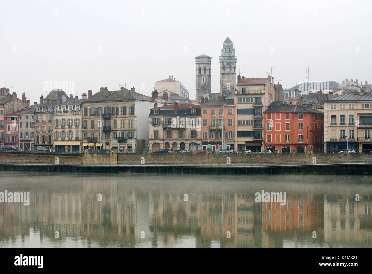 City buildings adjacent to the Saone River, Macon, France, on a cold winter's day Stock Photo