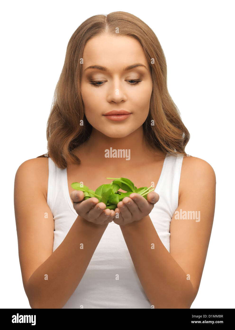 woman with spinach leaves on palms Stock Photo Alamy
