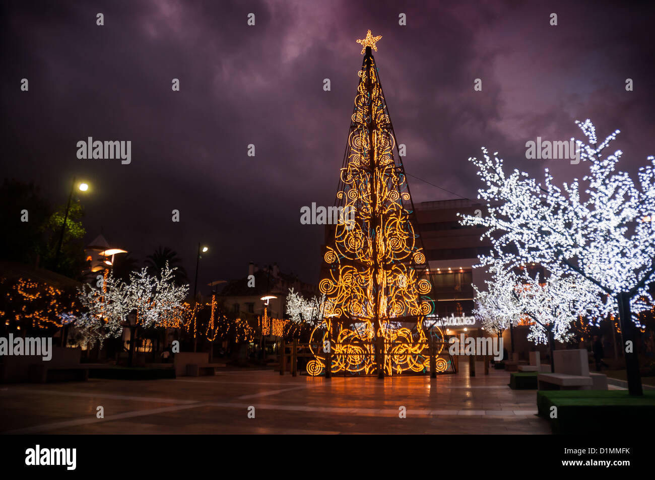 An illuminated modern Christmas tree in the town square Stock Photo