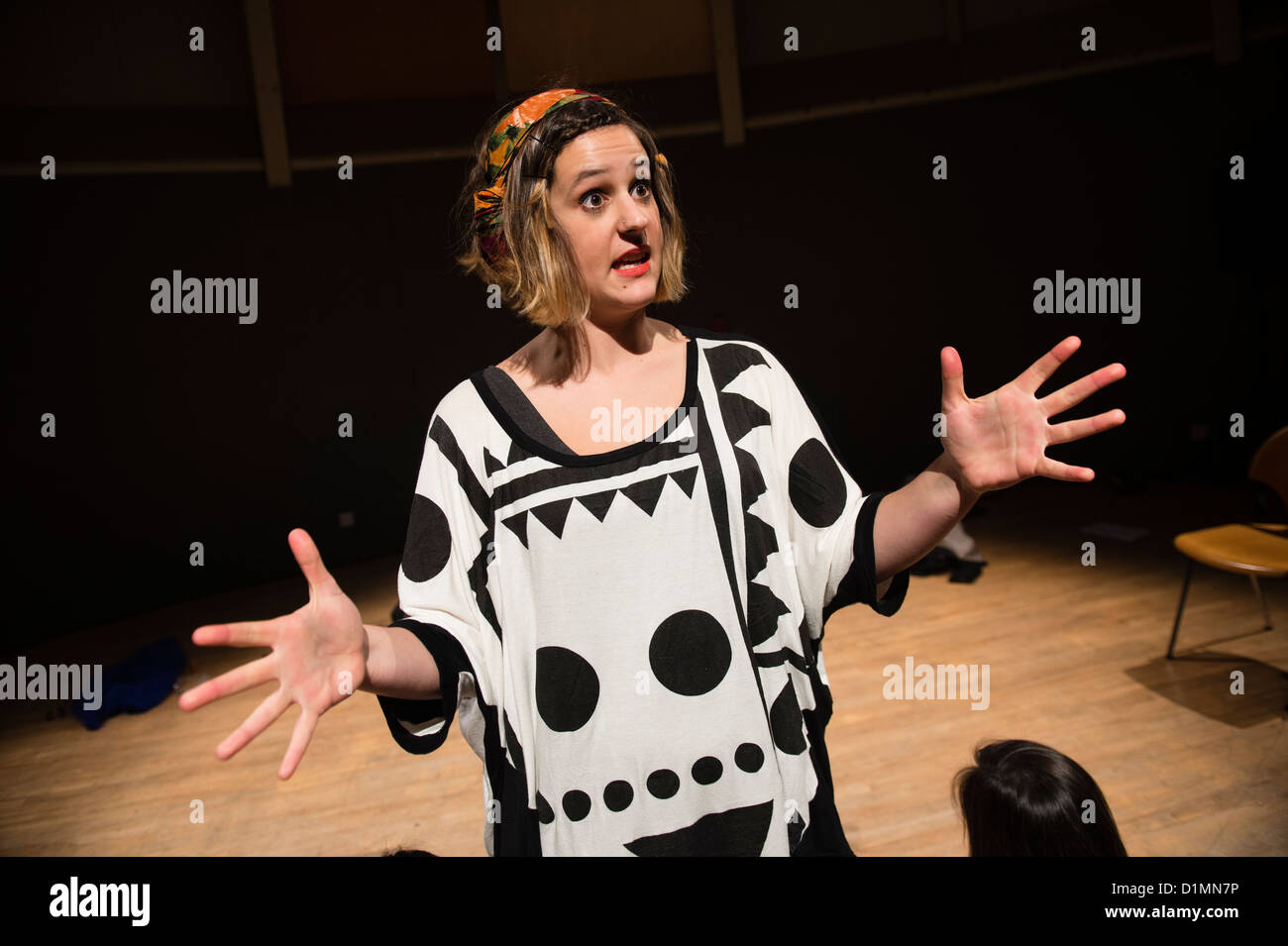 A young woman performing a devised improvised comedy theatre act, Aberystwyth Arts Centre, Wales UK Stock Photo