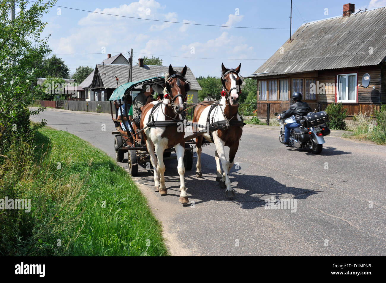 Outskirts of Bialowieza municipality in Eastern Poland. Horse-drawn cart. Stock Photo