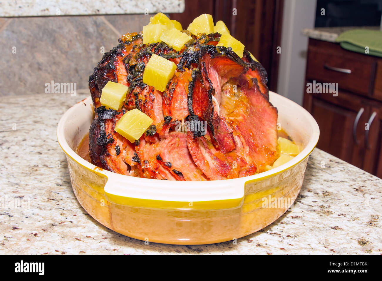 Baked Spiral Cut Honey Ham with Cloves and Pineapple Chunk Stock Photo