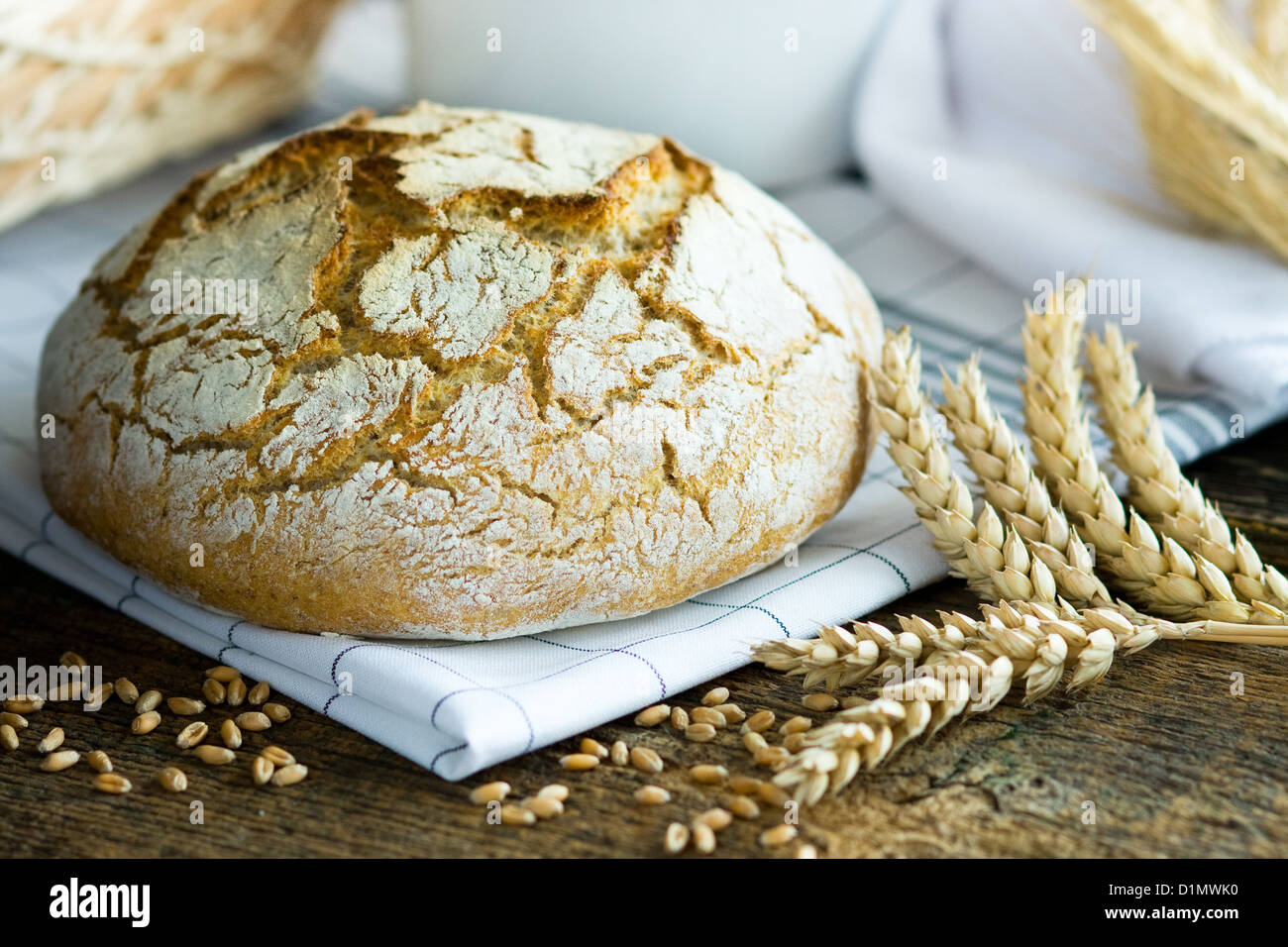 Fresh homemade bread and wheat spike Stock Photo