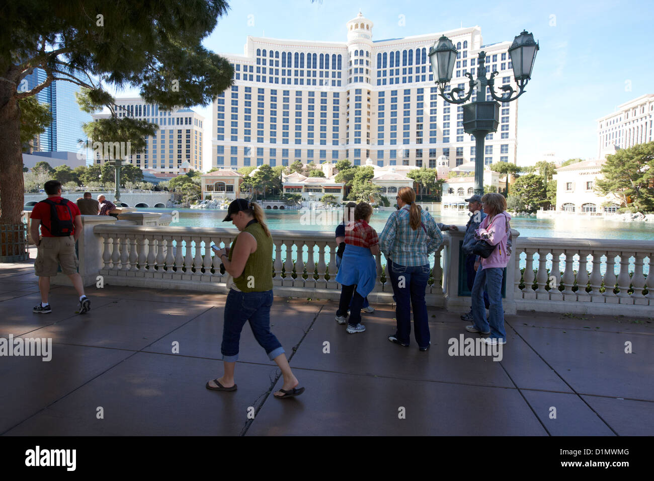 tourists walking along las vegas boulevard outside the bellagio hotel and casino Las Vegas Nevada USA Stock Photo
