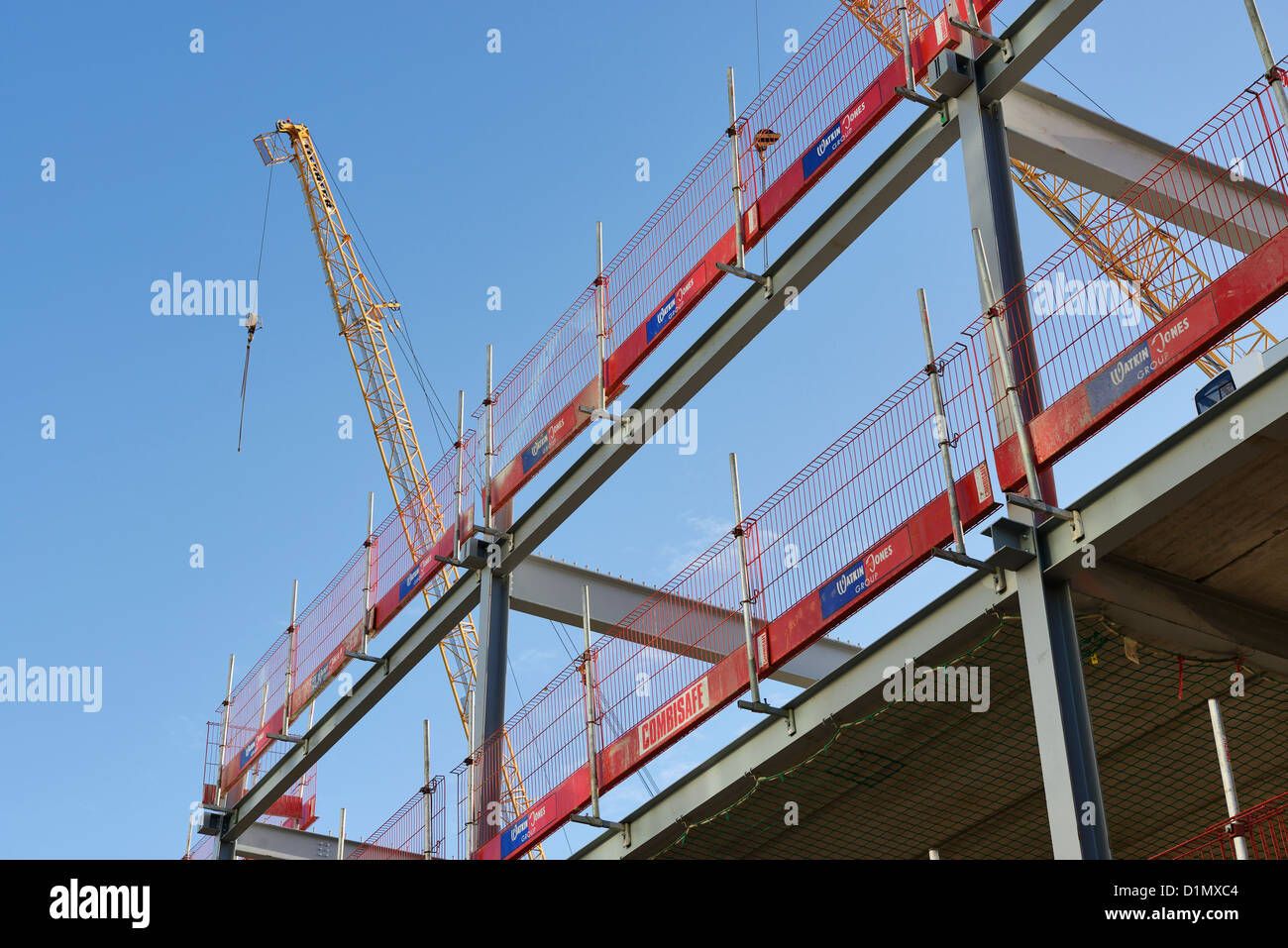 Steel frame with a safety rail on a UK construction site Stock Photo
