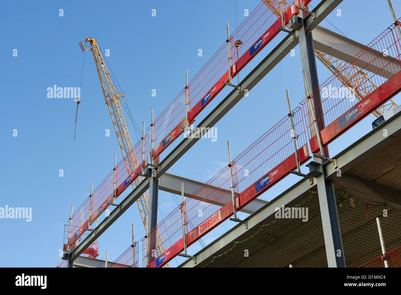 Steel frame with a safety rail on a UK construction site Stock Photo