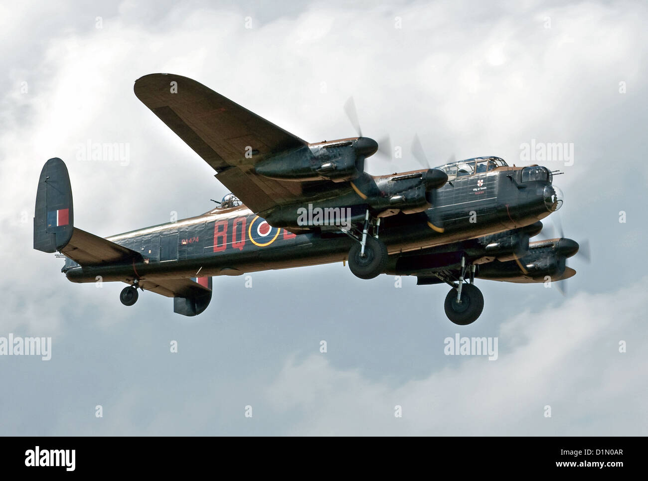 Much-loved Avro Lancaster PA474 'City of Lincoln' makes a slow pass with wheels and flaps down at the Sywell Air Show 2012 Stock Photo