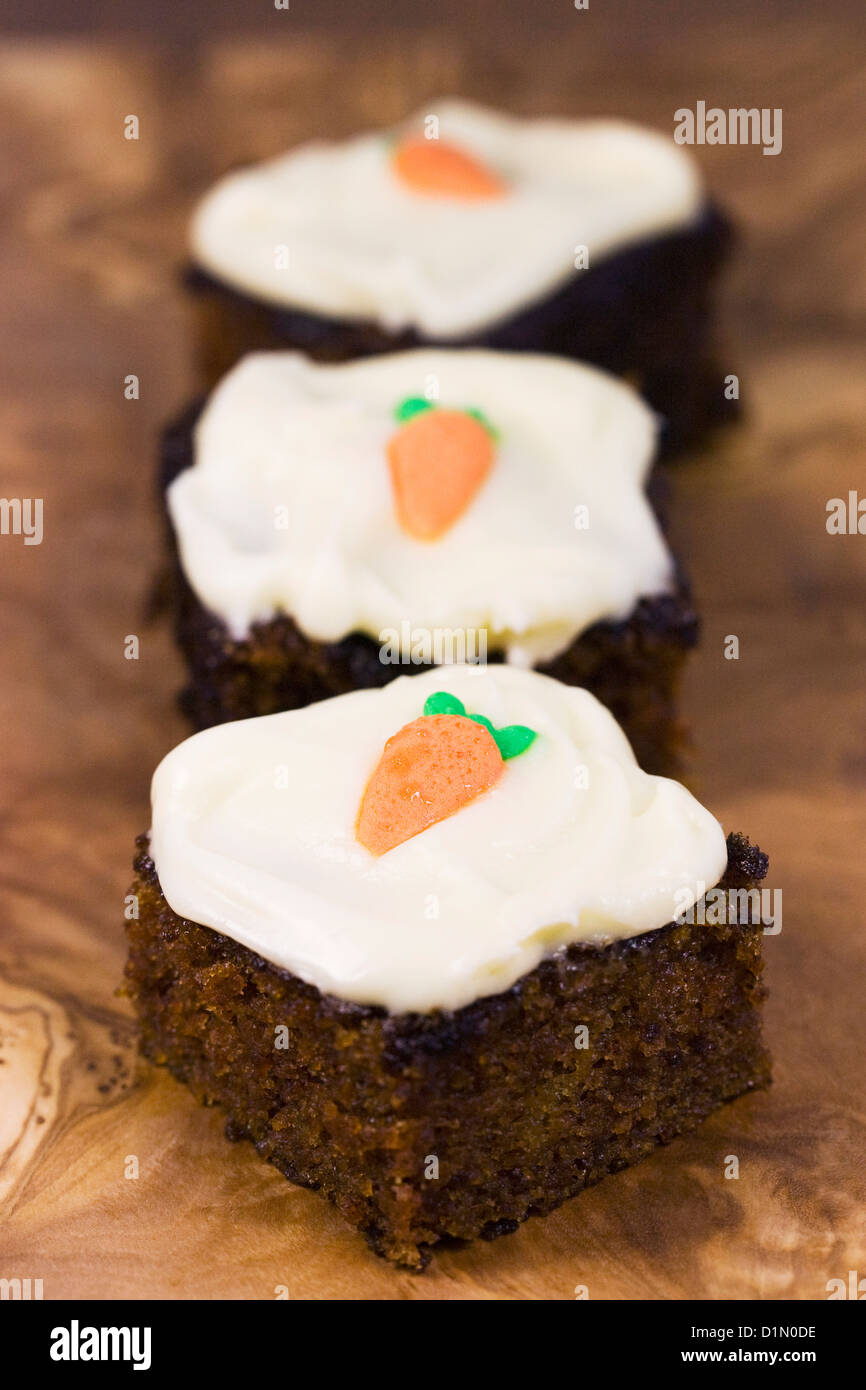 Homemade carrot cake on a wooden serving board. Stock Photo