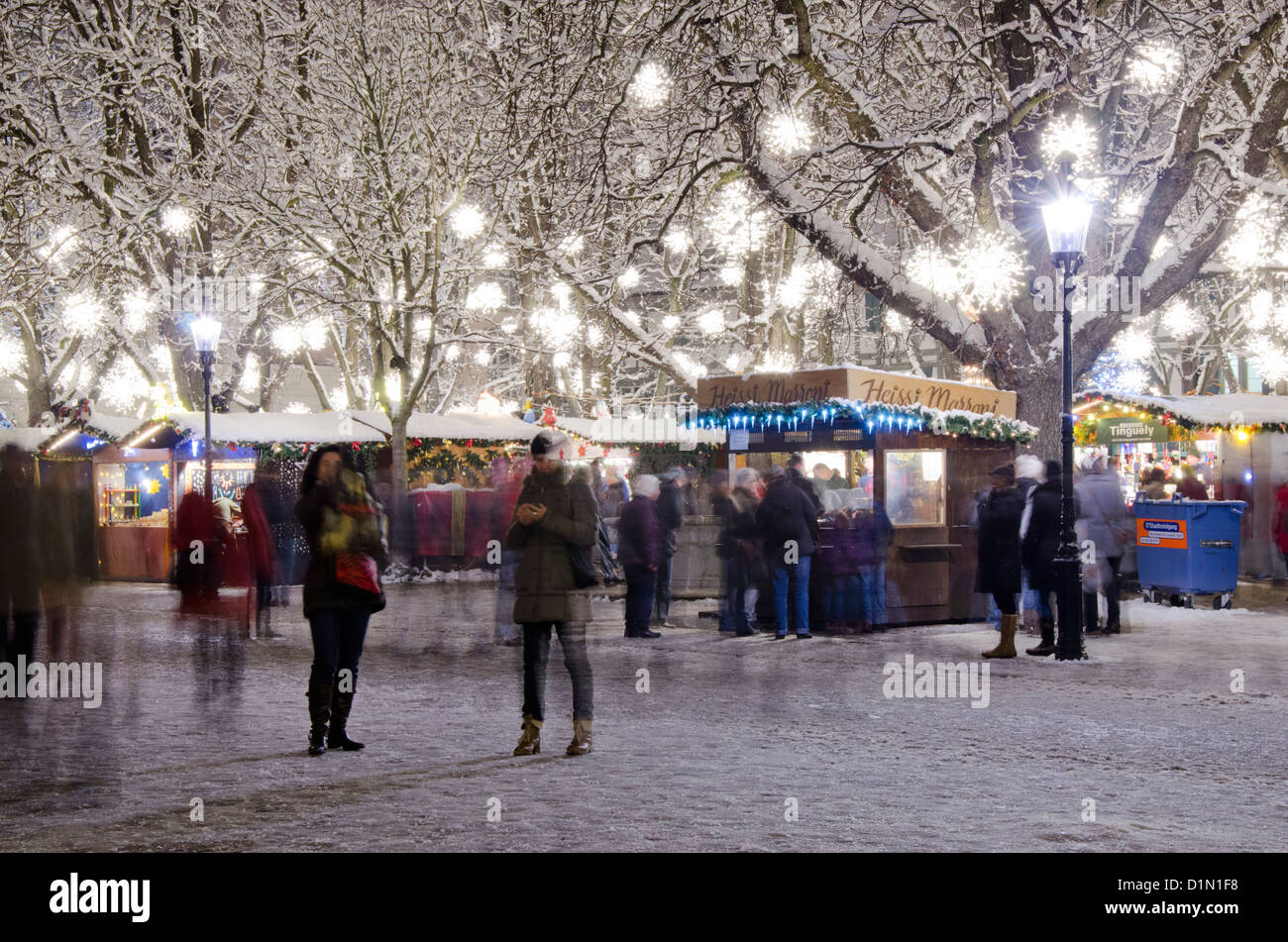 Switzerland, Basel. Munsterplatz Winter Holiday Market (aka Le Marche de Noel du Munsterplatz). Stock Photo