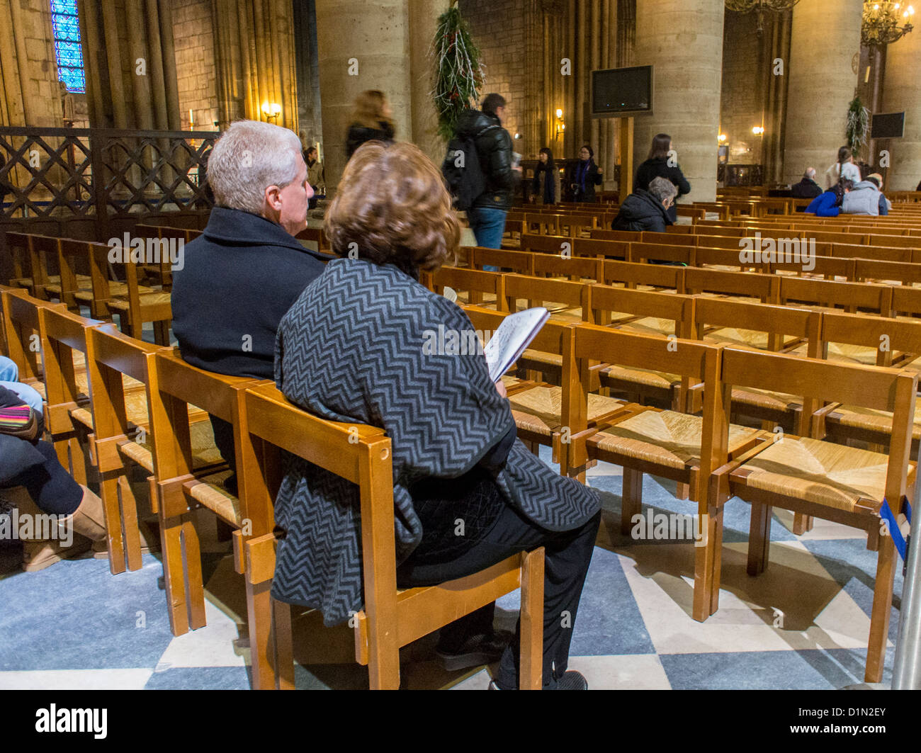 Paris, France, Couple Sitting, Praying Inside Catholic Church, Notre