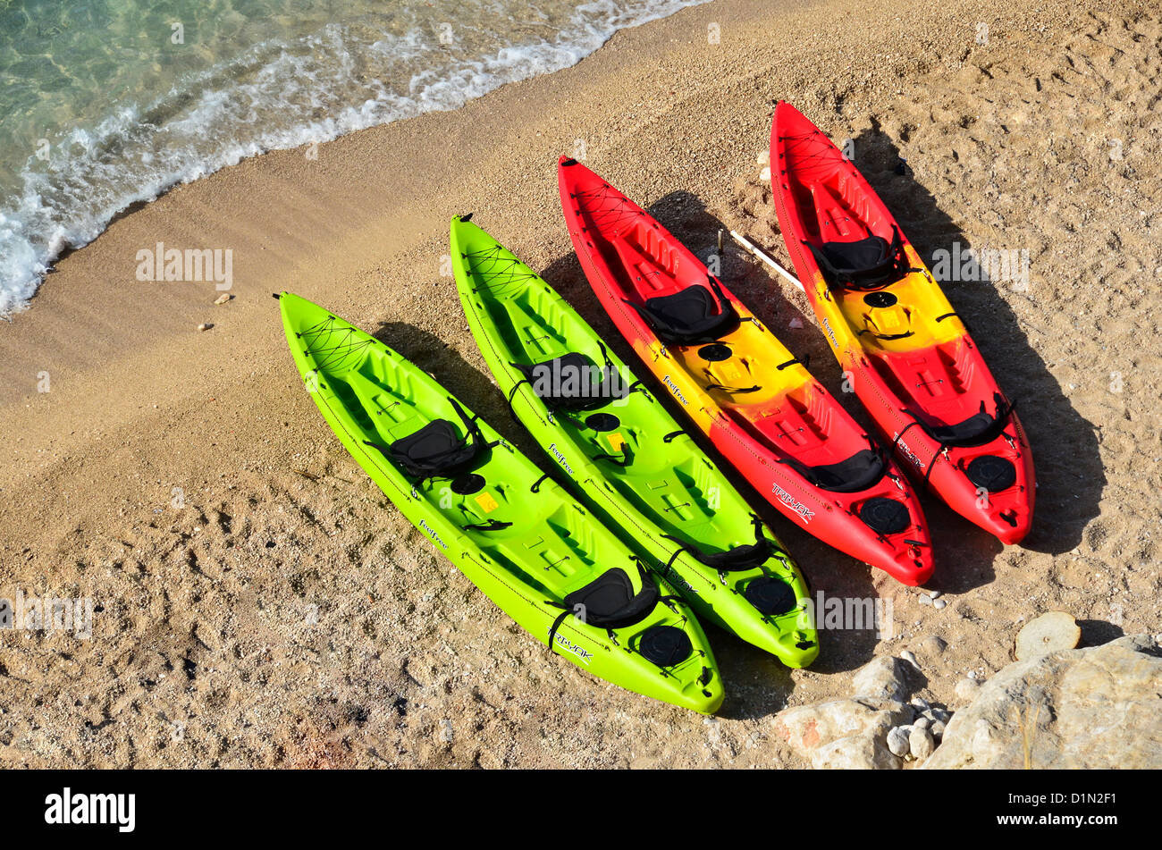 Very coloured canoe boats on a beach outside the old city walls of Dubrovnik, Croatia Stock Photo