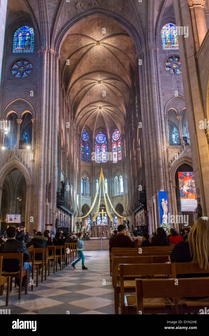 Paris, France, People praying Inside Catholic Church, Notre Dame Stock