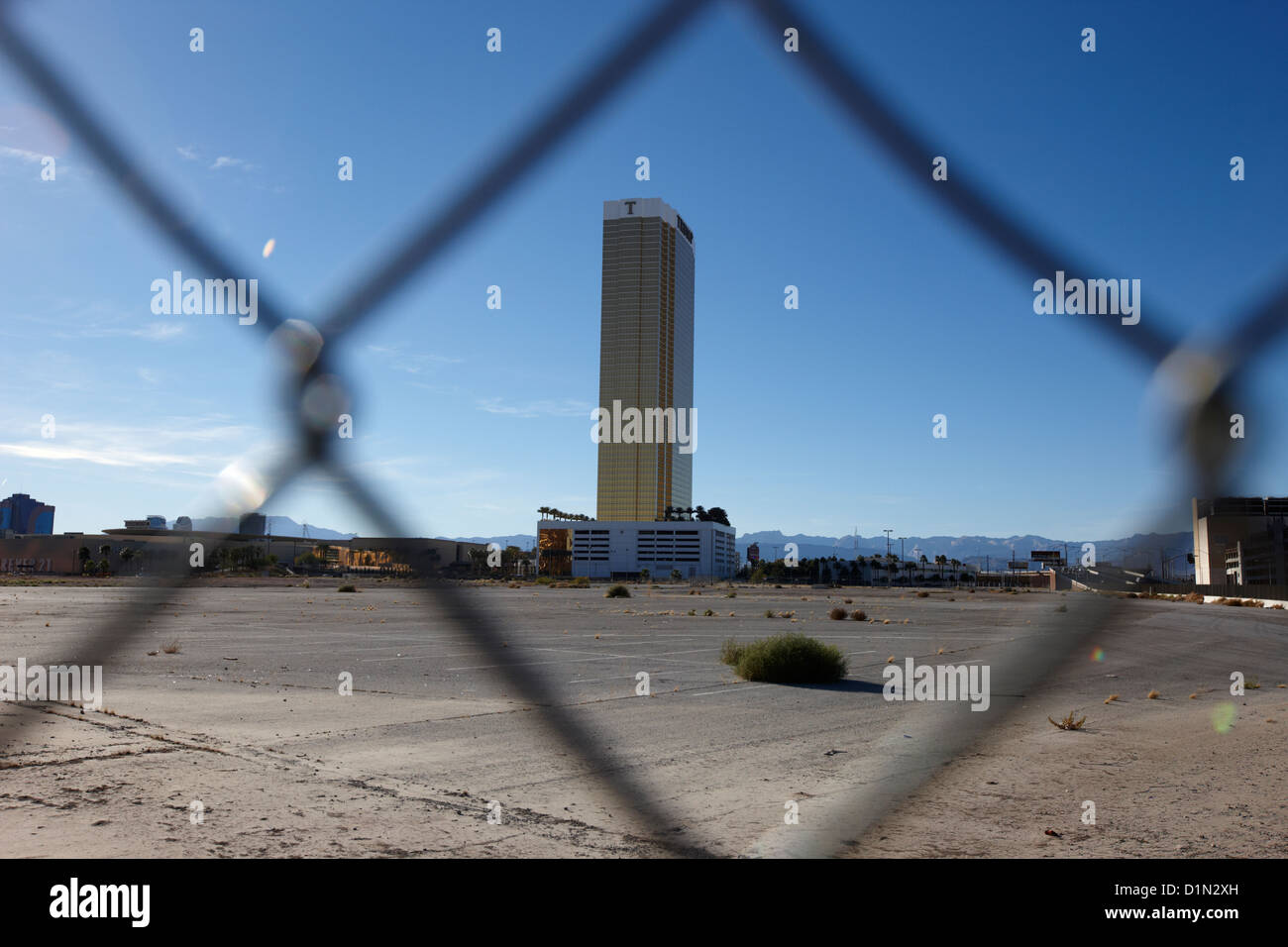 las vegas plaza chain link fence around empty vacant unused lot with view towards the trump tower on the Las Vegas strip Nevada Stock Photo