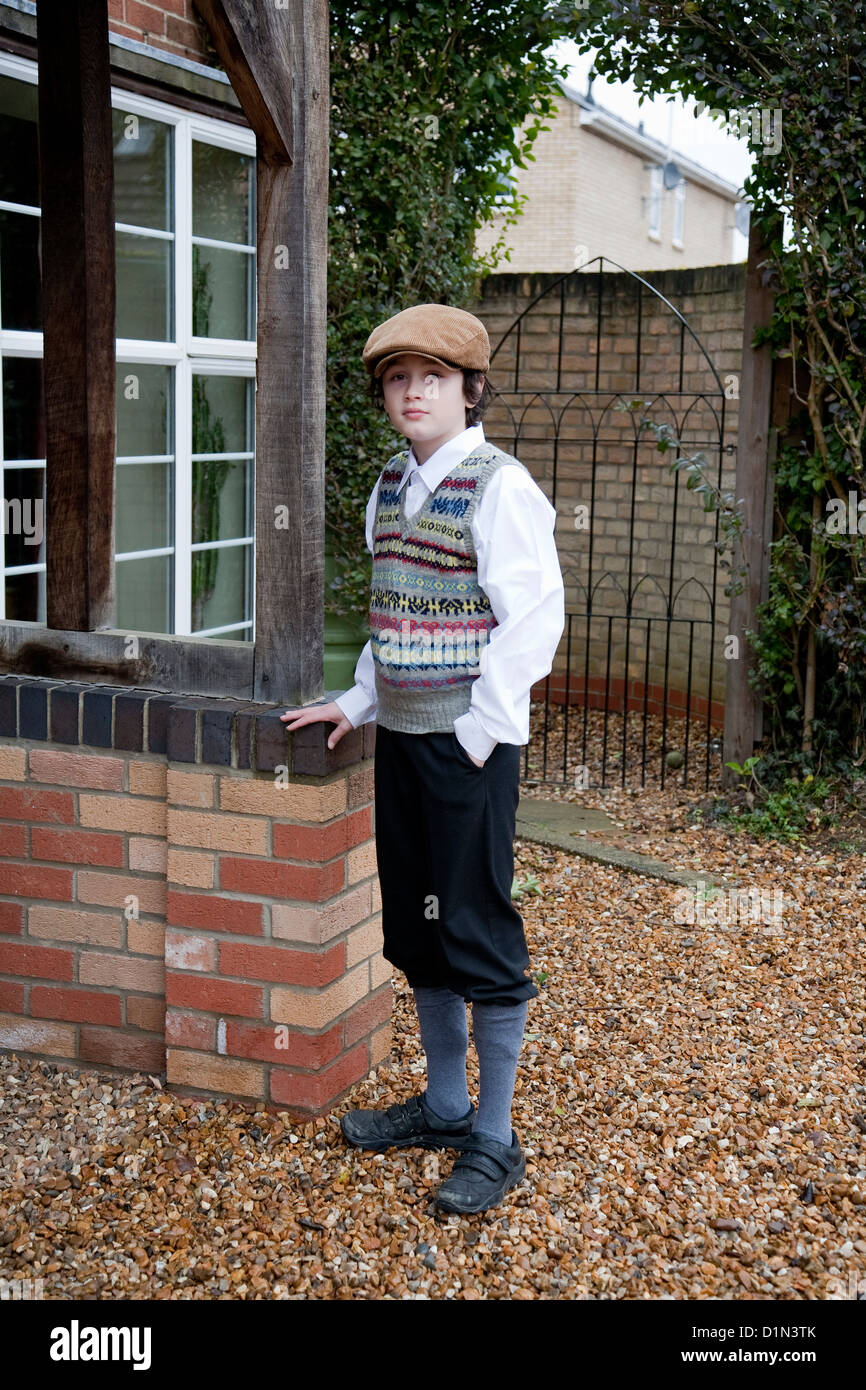 Flat cap boy dressed up as a Victorian Stock Photo - Alamy