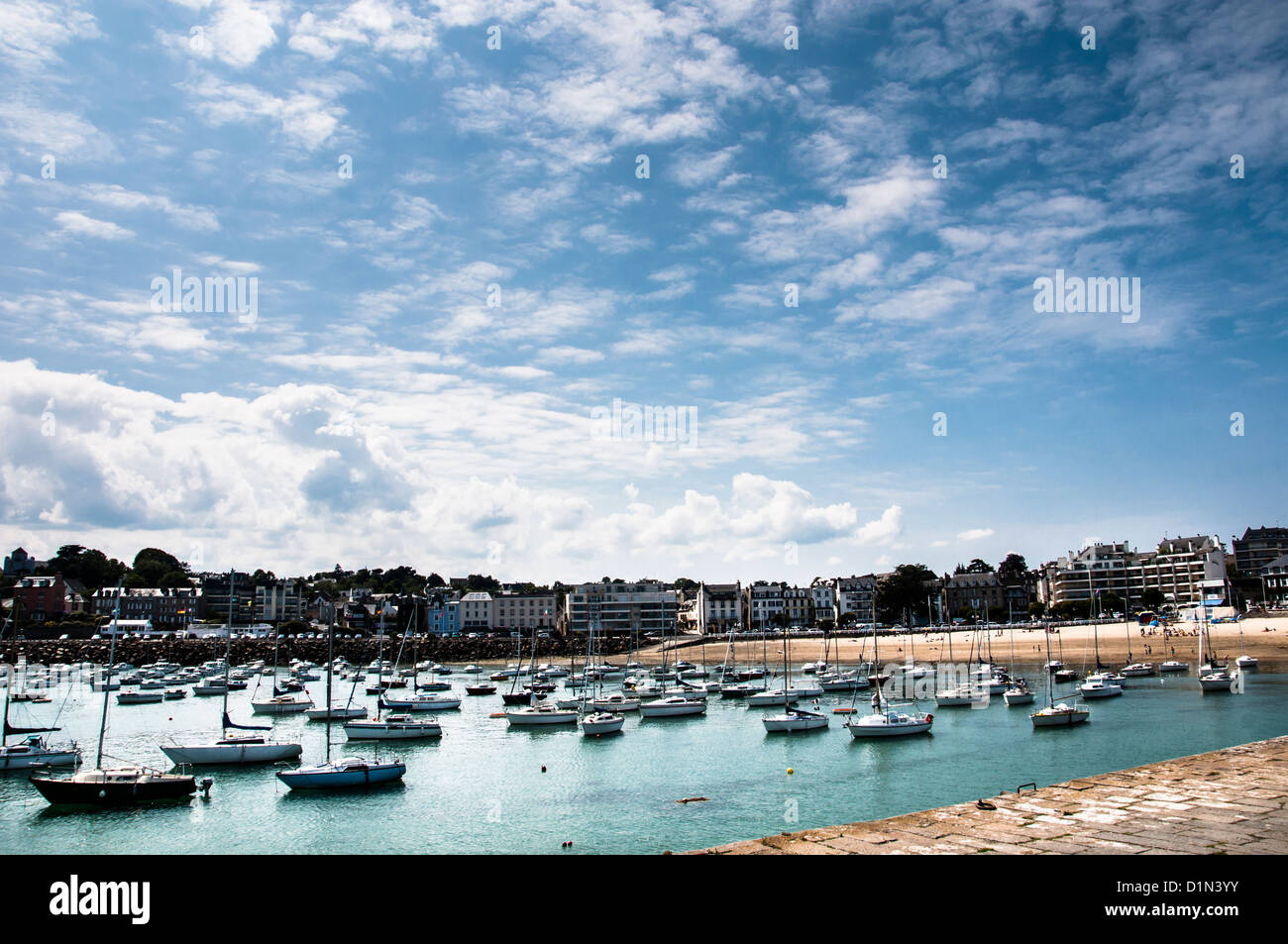 Pleasure boats in Saint-Quay Portrieux Marina in Brittany France, with blue sky, Côtes d'Armor for cruising, vacation, holiday Stock Photo