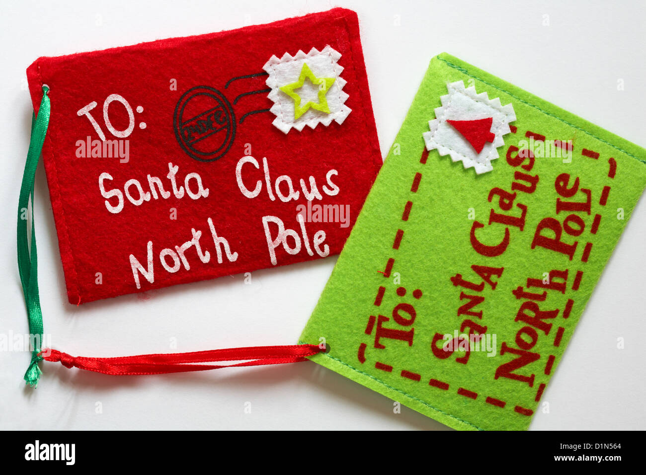 letter felt Christmas decorations addressed to Santa Claus North Pole post dated 24 Dec set on white background Stock Photo