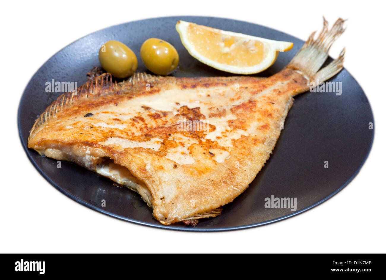 fried sole fish on black plate isolated on white background Stock Photo