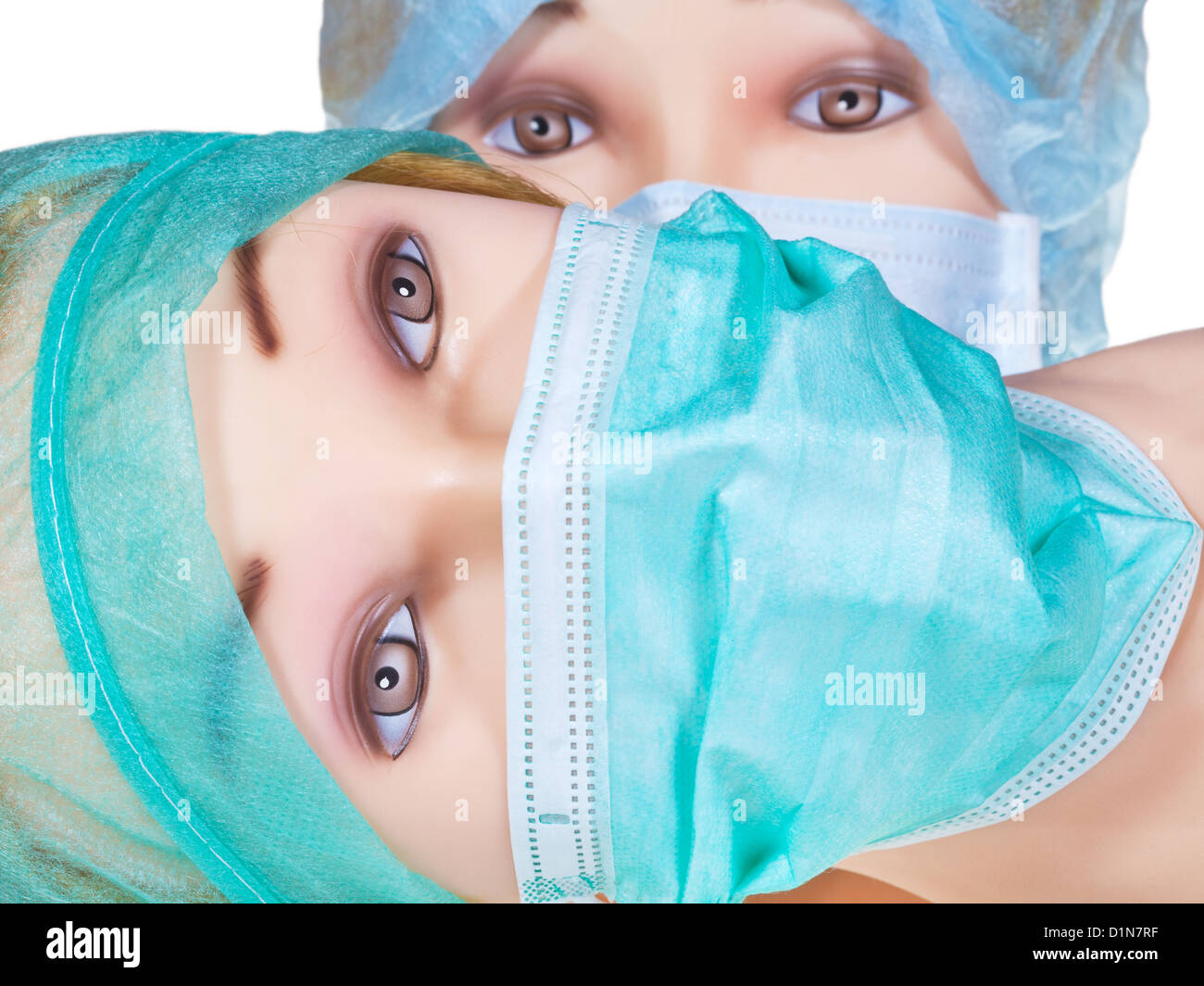 two female dummy doctor heads wearing textile surgical cap and medical