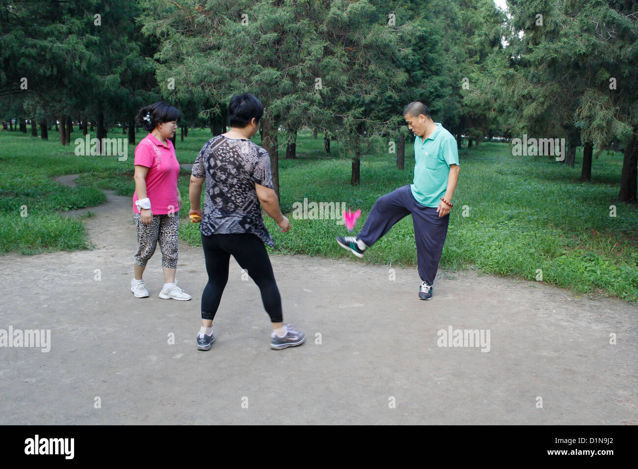 china people playing feather ball Stock Photo