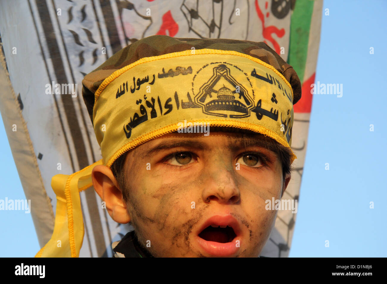 Dec. 31, 2012 - Gaza, Gaza Strip, Palestinian Territory - A Palestinian child wears a headband of Fatah movement during a rally in Gaza city on December 31, 2012. The Gaza branch of Palestinian president Mahmud Abbas's Fatah party said on Friday it will mark its anniversary in the Hamas-ruled enclave after an accord between the two factions  (Credit Image: © Ezz Al-Zanoon/APA Images/ZUMAPRESS.com) Stock Photo