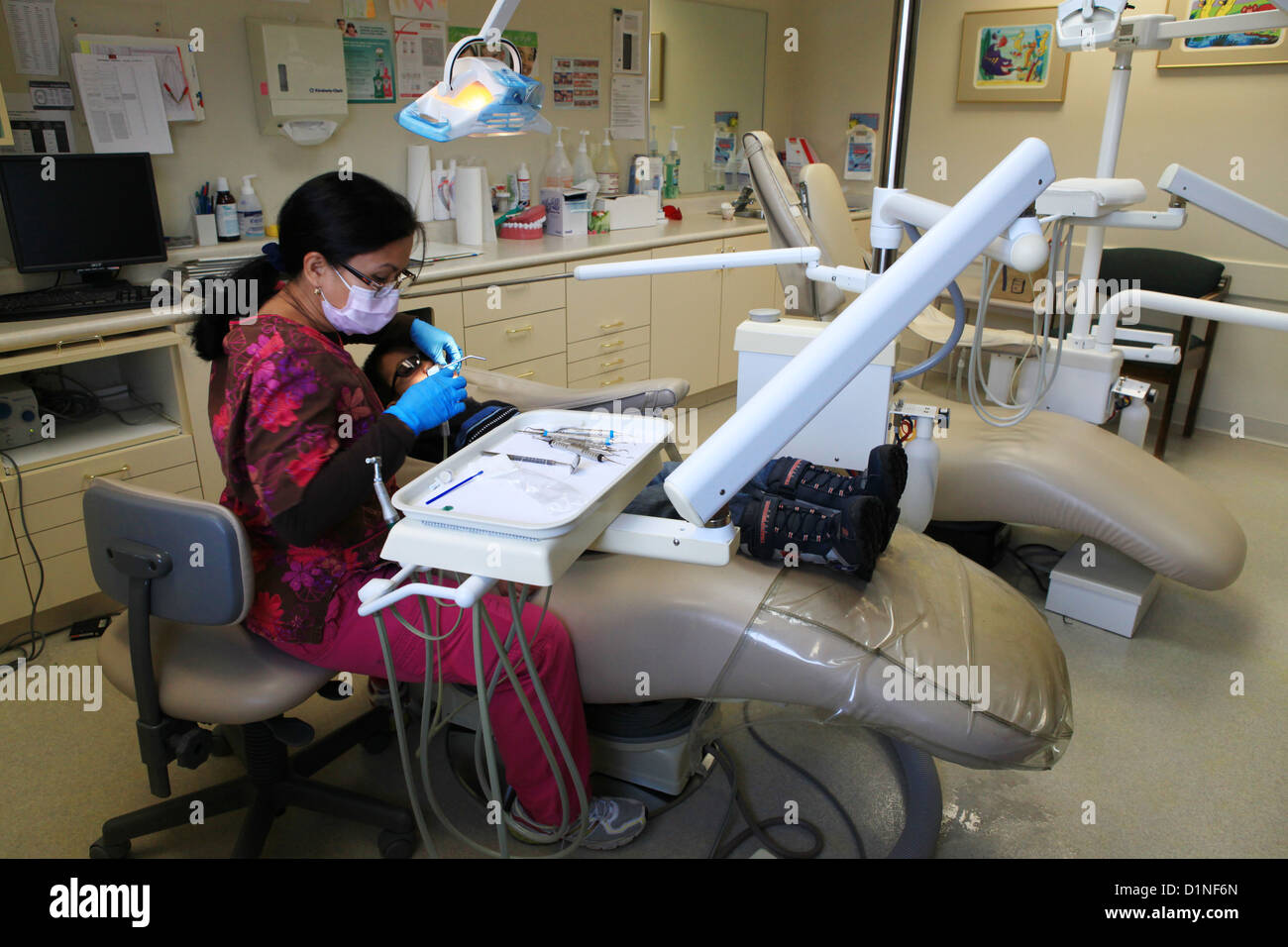 Dental nurse performing fluoride therapy hires stock photography and images Alamy