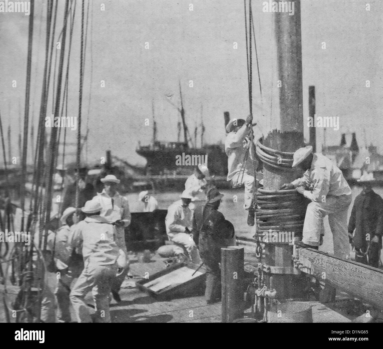 Hoisting men to scrape the masthead - Sailing ship Maintenance - 1895 Stock Photo