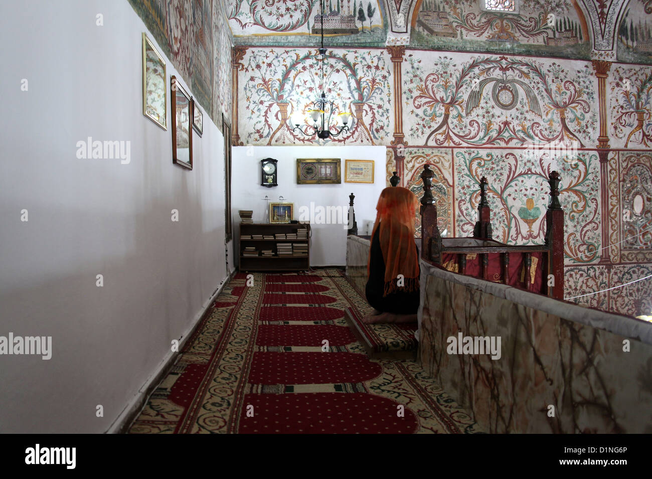 Woman Praying inside the Et'hem Bey Mosque in Tirana Stock Photo