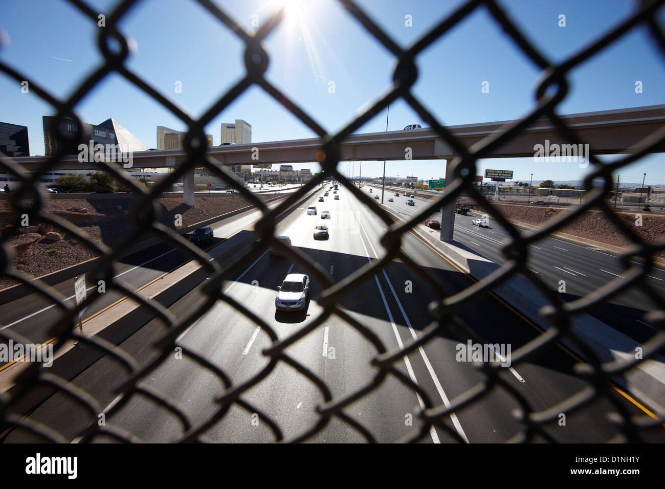 safety chain link fence screen looking down over i15 interstate in Las
