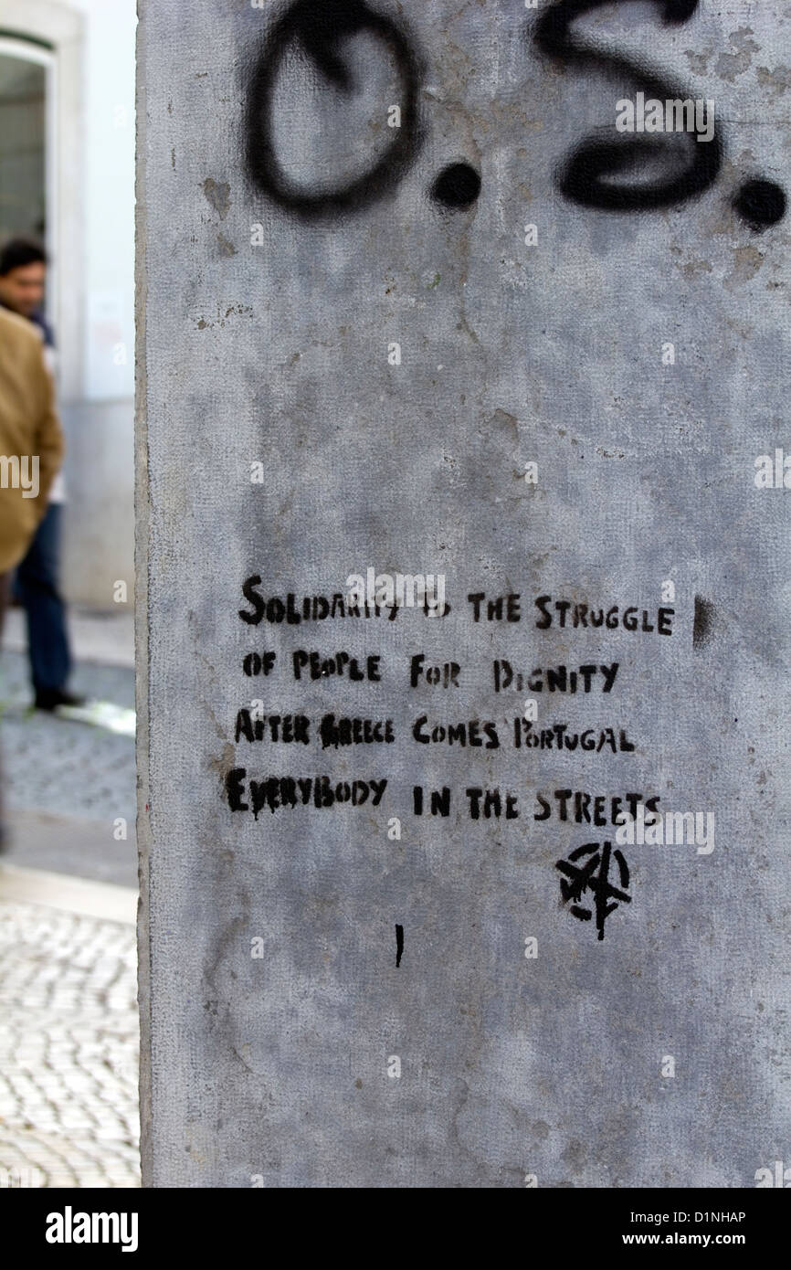 An anarchist graffiti slogan in Lisbon Portugal referring to the Greek economy default and the possibility of Portugal also Stock Photo