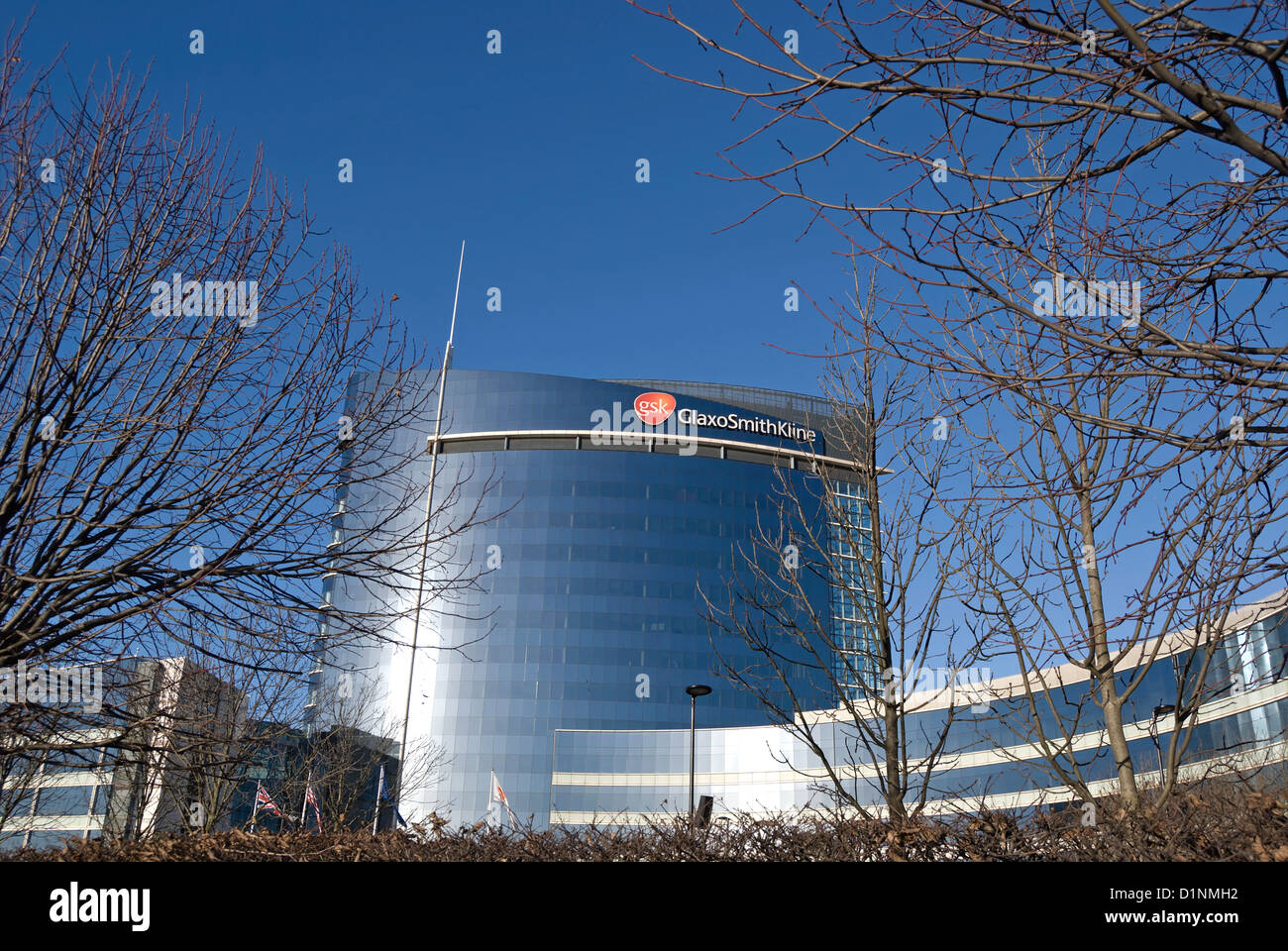 main building of gsk, or glaxo smith kline, at the pharmaceutical company's world hq in brentford, london, england Stock Photo