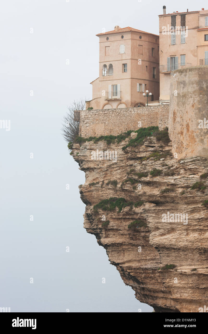 Air foundation. Home in the city of Bonifacio standing on top of an impressive overhang. Corsica, France. Stock Photo