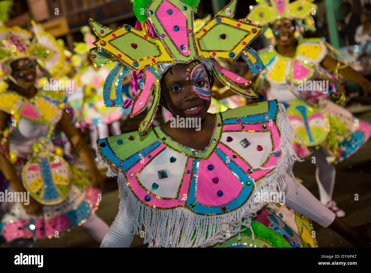 Costumed dancers celebrate the New Year with the Junkanoo Parade on January 1, 2013 in Nassau, Bahamas. The carnival like festival is celebrated in the early hours of the New Year lasting until the late morning and dates back to slavery days. Stock Photo