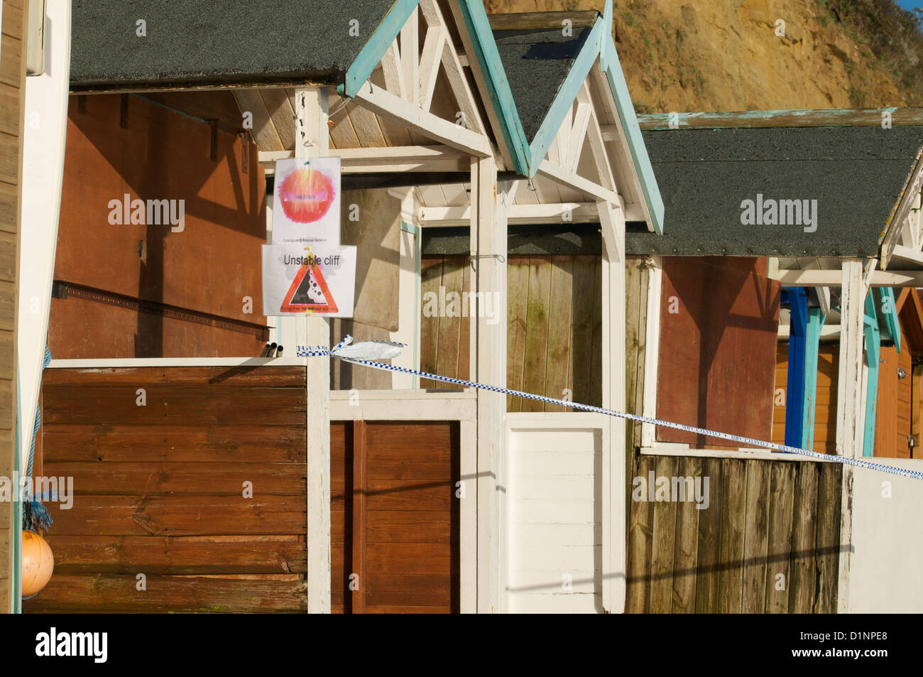 Swanage cliffs and beach huts at the northern end of Swanage bay Stock Photo