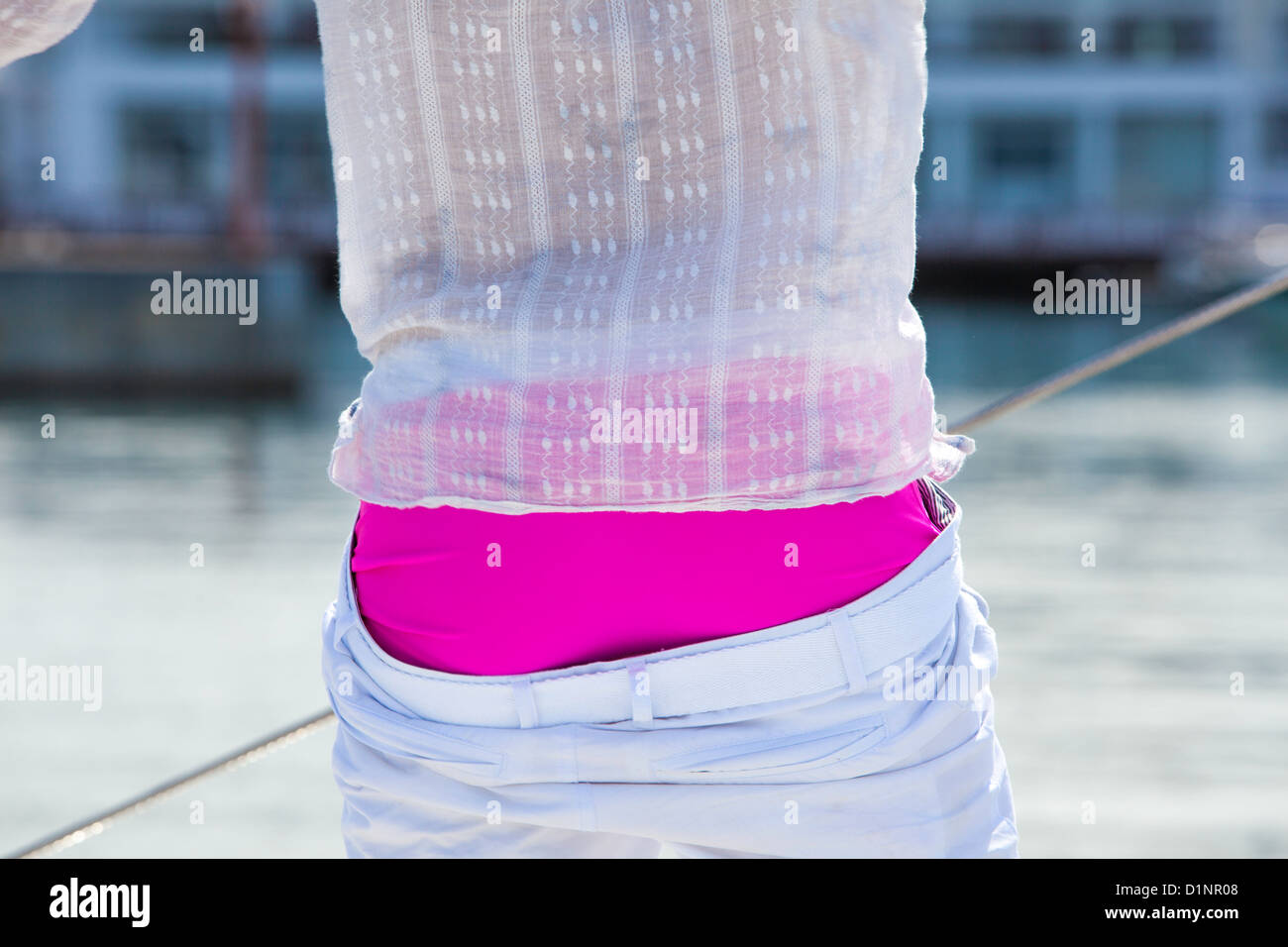 Man shows off fit body and luminous pink shorts Stock Photo