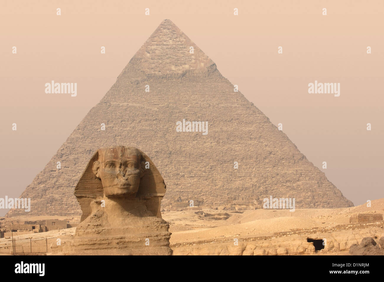 the Giza Necropolis with pyramid and Sphinx at evening time Stock Photo