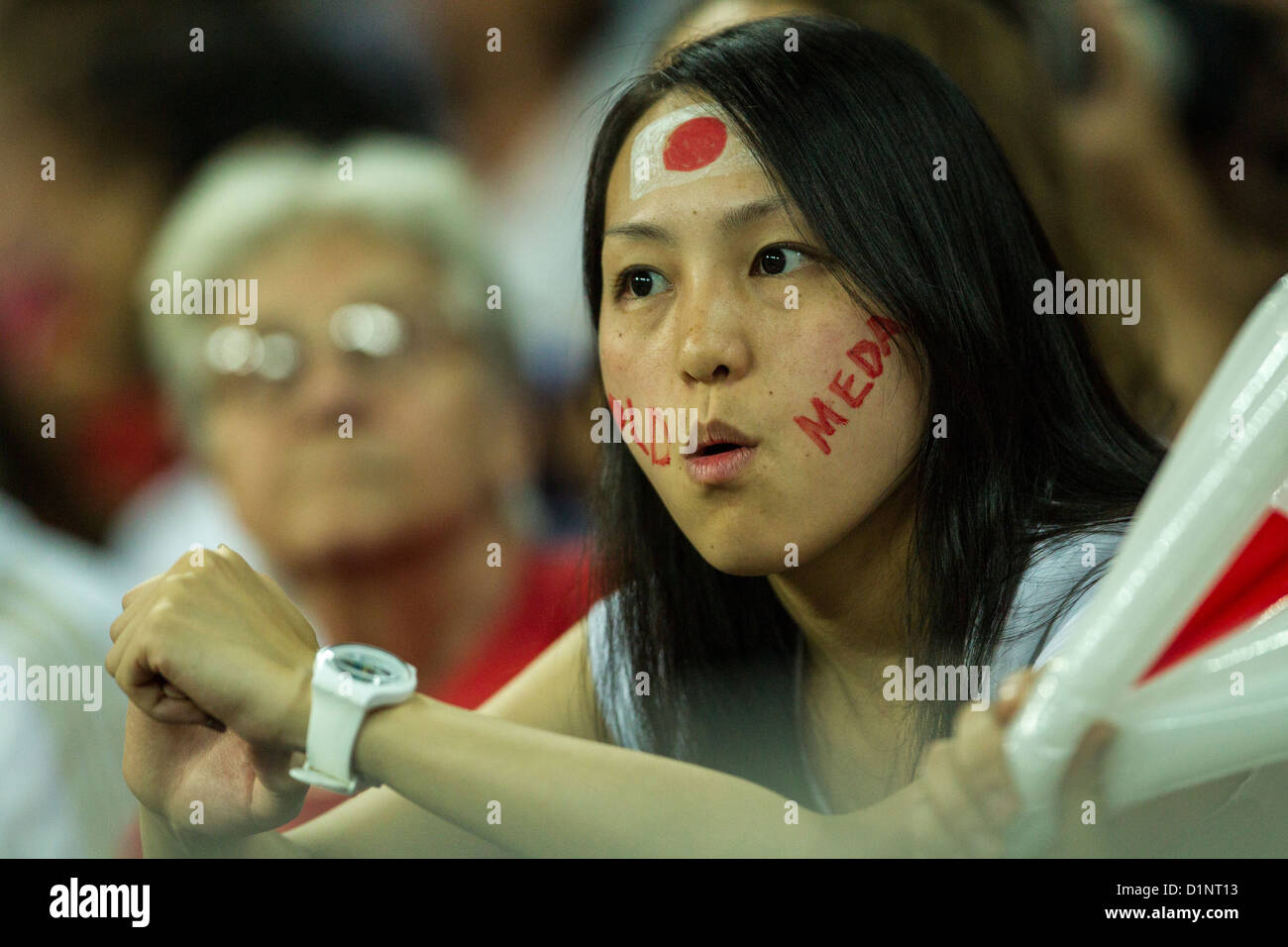 Japanese fan watches USA wins gold over Japan in Women's Football (soccer) at the Olympic Summer Games, London 2012 Stock Photo
