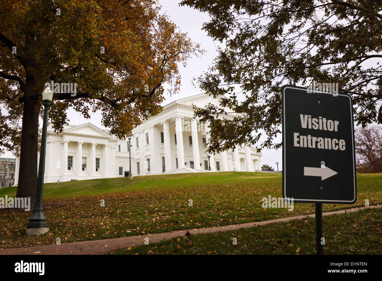 A sign to visitor center in front of the State Capitol building in