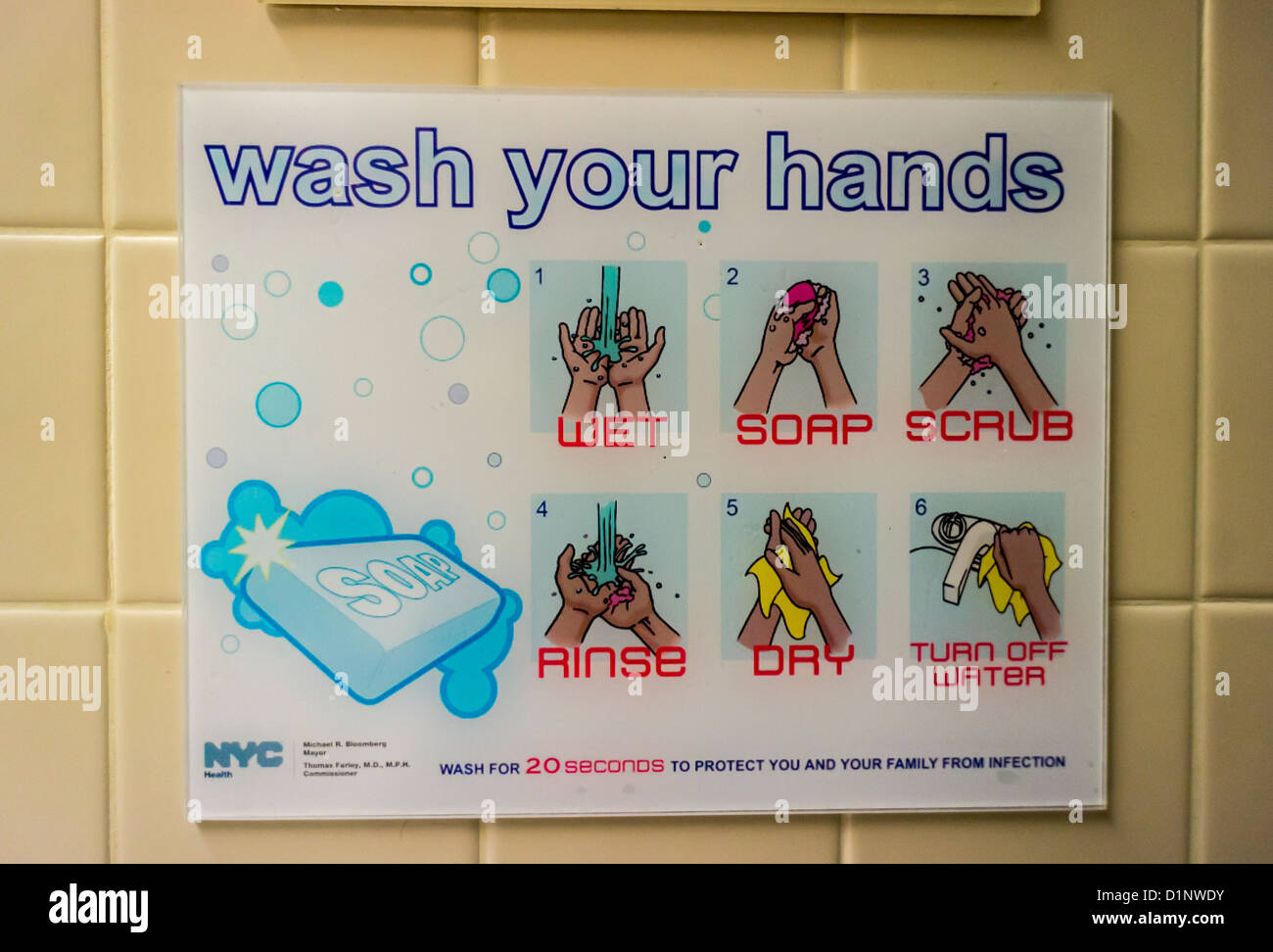 A poster in a public bathroom in New York encourages hand washing and