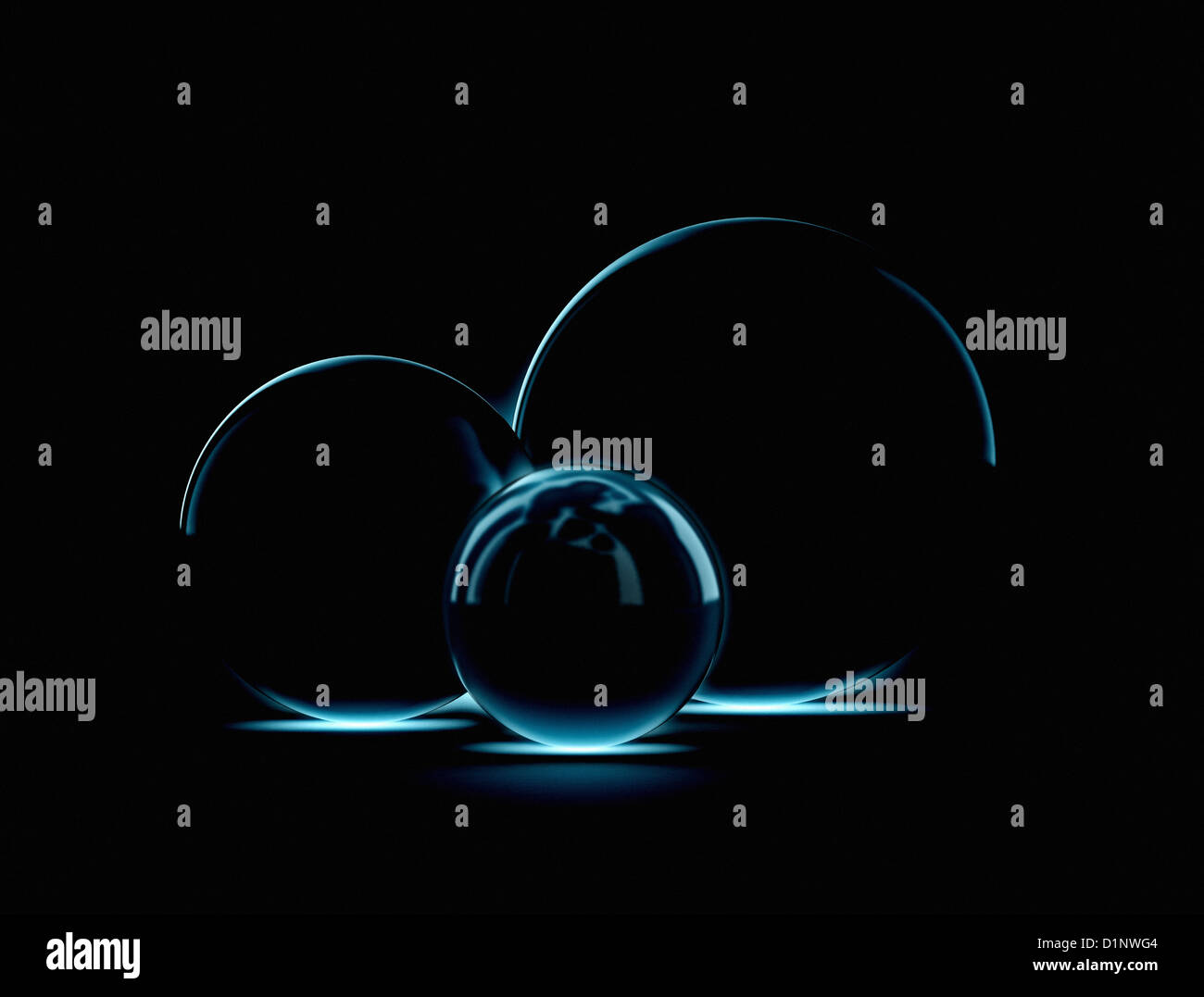 Three blue glass spheres glow Stock Photo - Alamy