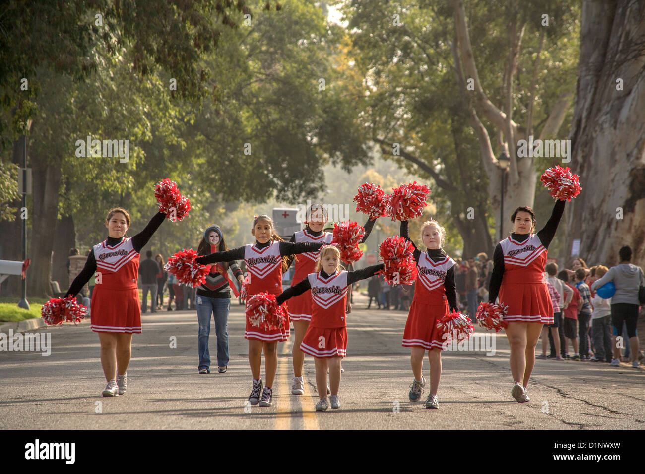 A team of deaf cheerleaders leads a Christmas parade at the California School for the Deaf in Riverside, CA. Stock Photo