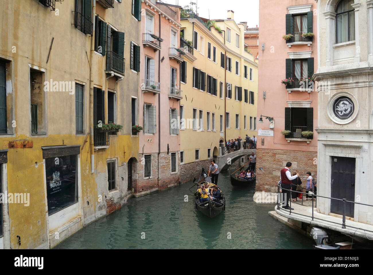 Gondolas on a side canal in Venice. Stock Photo