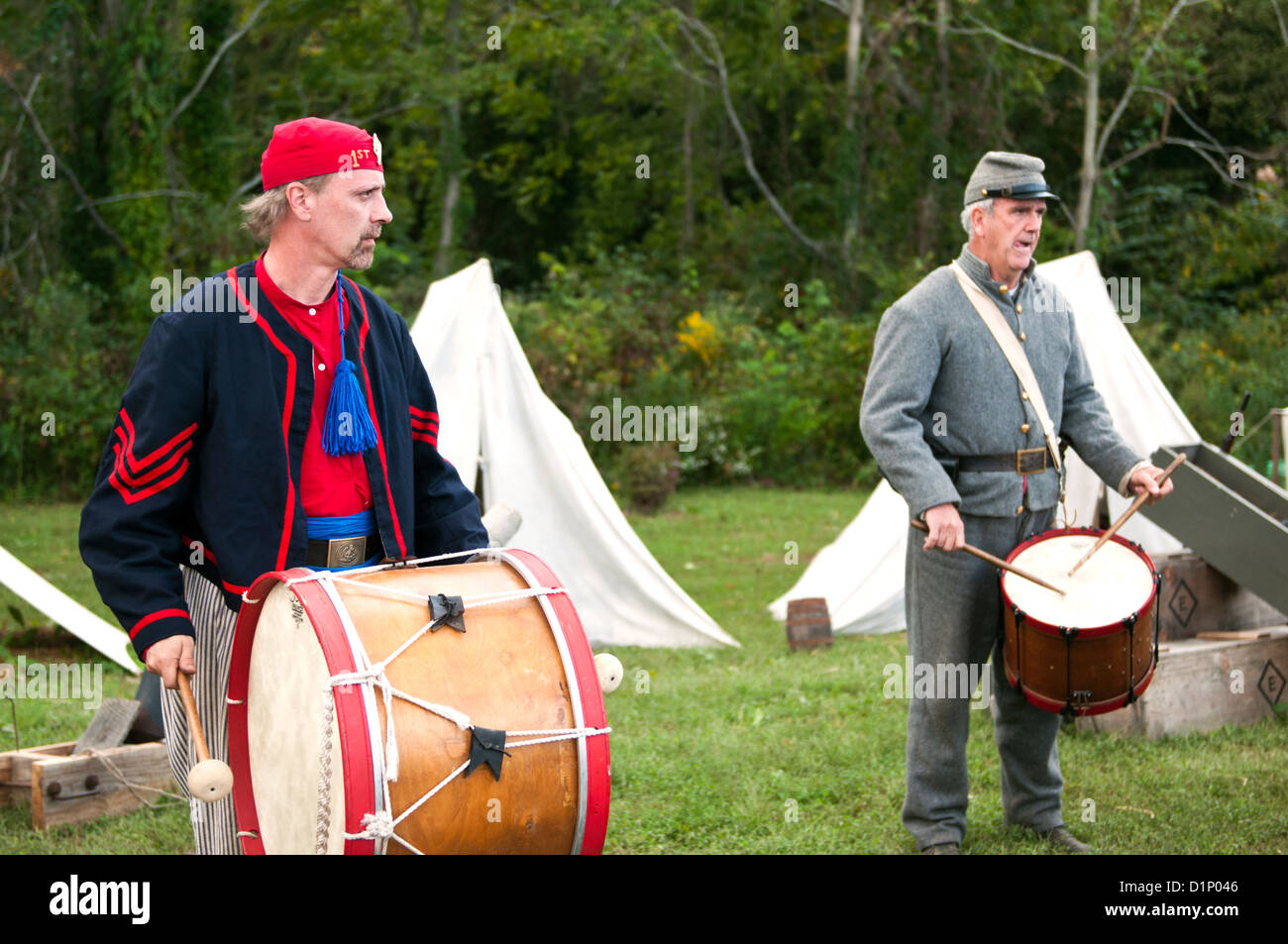 Two men dressed as US Civil War Confederate soldiers drumming at an encampment at the Virginia State Fair in Richmond Virginia. Stock Photo
