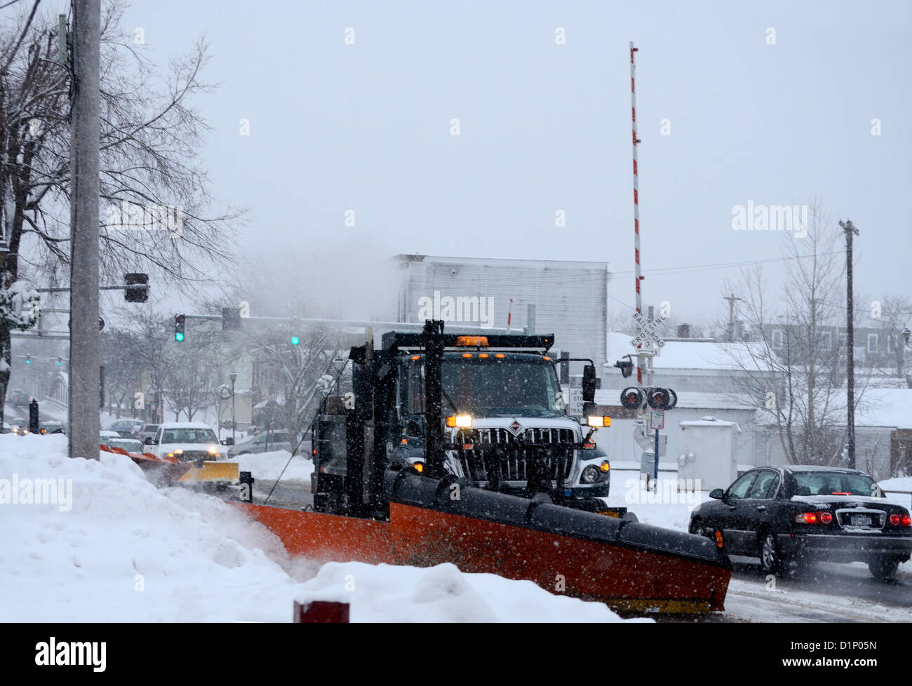 Snow plow clearing Main street in upstate New York town Stock Photo Alamy