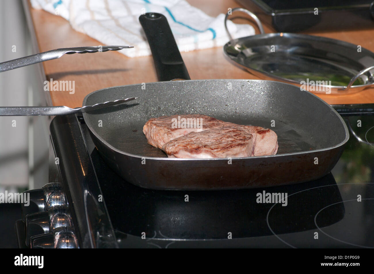 Fillet beef Steak Frying In A griddle Pan Stock Photo Alamy