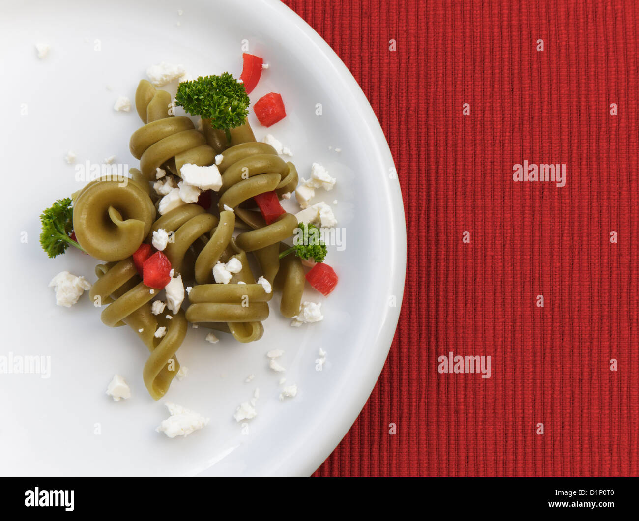 Pasta salad on white plate Stock Photo